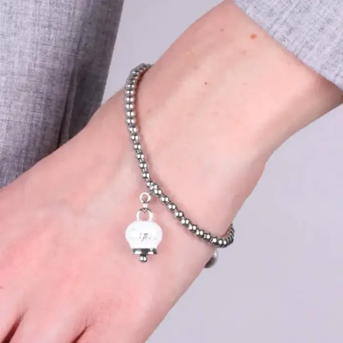 Bracciale in Acciaio a perline con campanella pendente bianca con scritta Capri