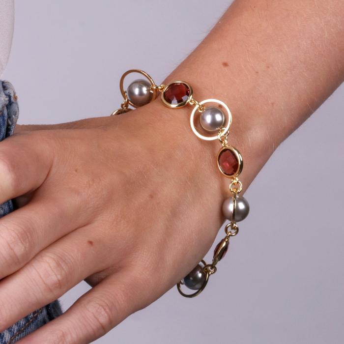 Metal bracelet with brown crystals, circles and beads