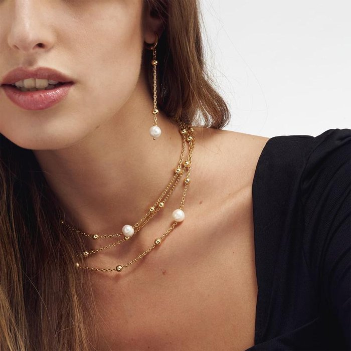 Orecchini in bronzo dorato con perla naturale