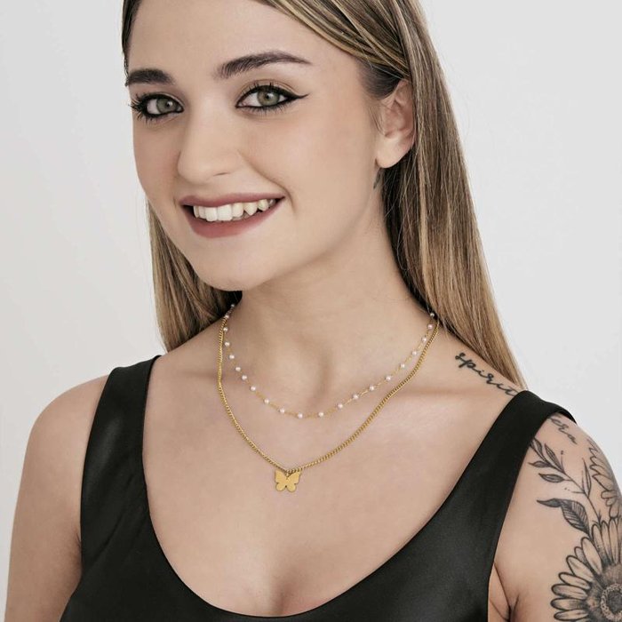 Collier en acier doré IP avec papillon