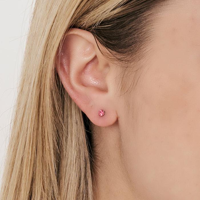 BOUCLE D'OREILLE UNIQUE POINT DE LUMIÈRE EN ACIER AVEC CRISTAL FUCHSIA 3 MM