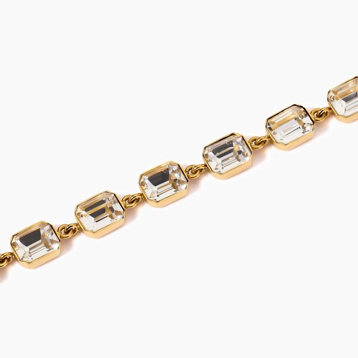 Golden bracelet with white crystals