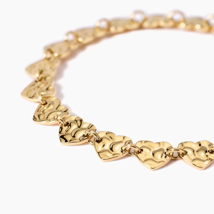 Bracelet doré avec coeurs effet martelé