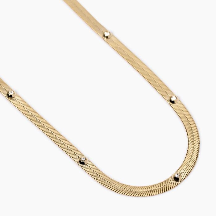 Golden choker with white crystals