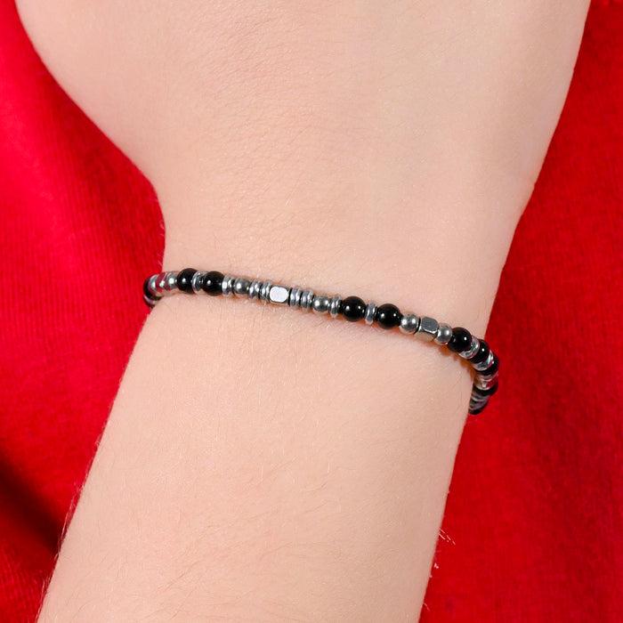 CHILDREN'S BRACELET IN STEEL WITH BLACK AND GREY STONES