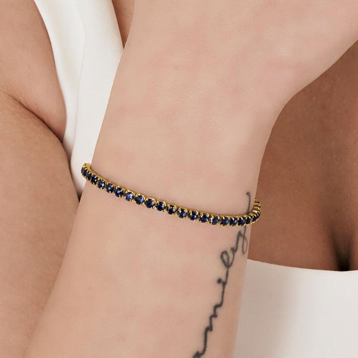 WOMEN'S TENNIS BRACELET IN IP GOLD STEEL WITH BLUE CRYSTALS