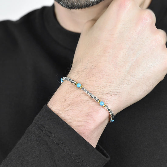 MEN'S BRACELET IN STEEL WITH BLUE STONES AND IP GOLD ELEMENTS