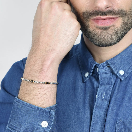 MEN'S BRACELET IN STEEL WITH BLACK STONES AND IP GOLD ELEMENTS