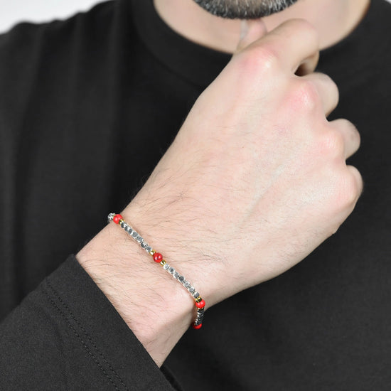 MEN'S BRACELET IN STEEL WITH RED STONES AND IP GOLD ELEMENTS
