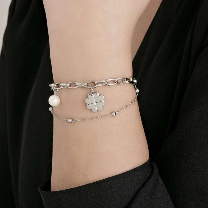 Steel bracelet with four-leaf clover and pearls