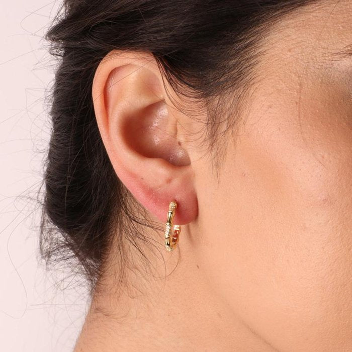 925 Silver earrings with hammered effect alternating with white zircons